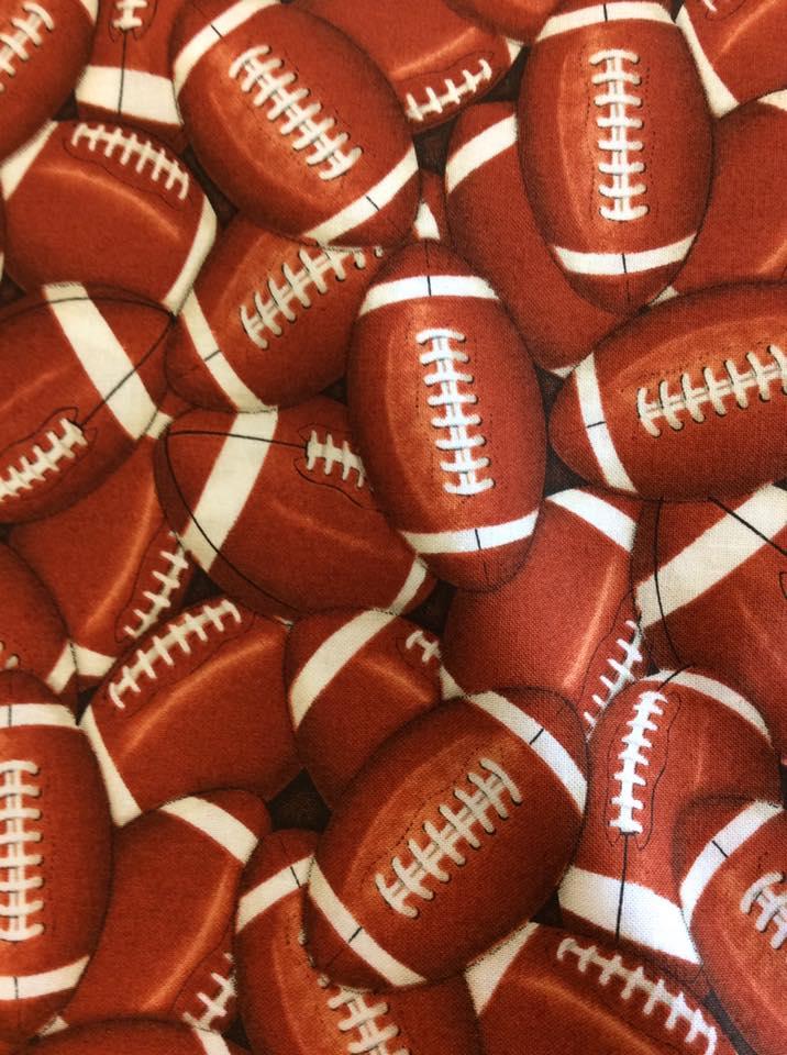 Packed Footballs by Timeless